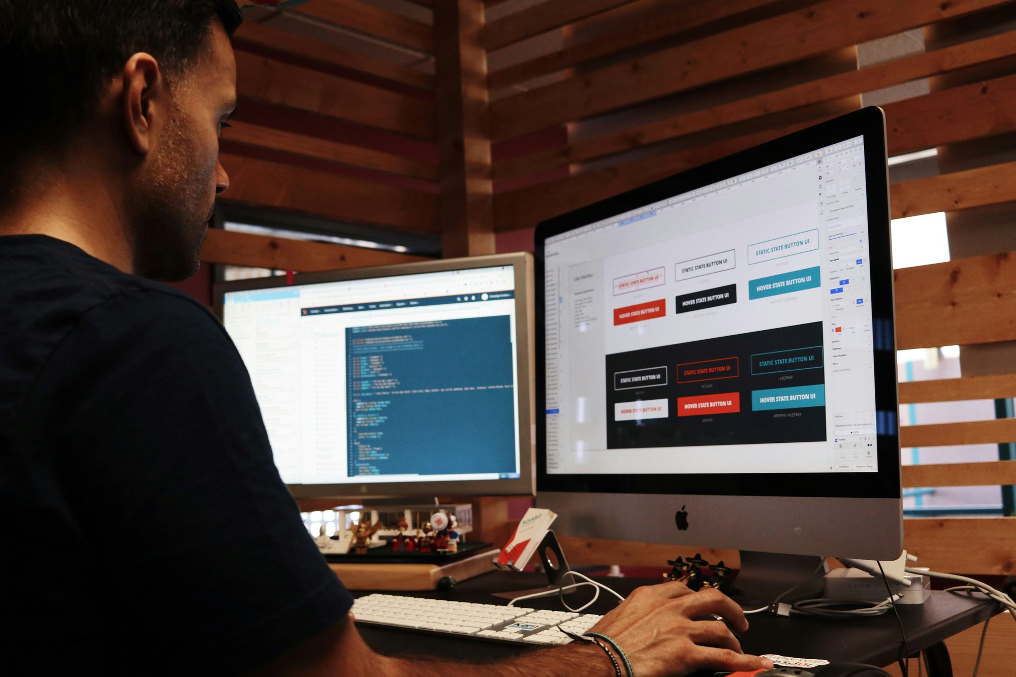 Two colleagues reviewing revenue dashboards on screen together